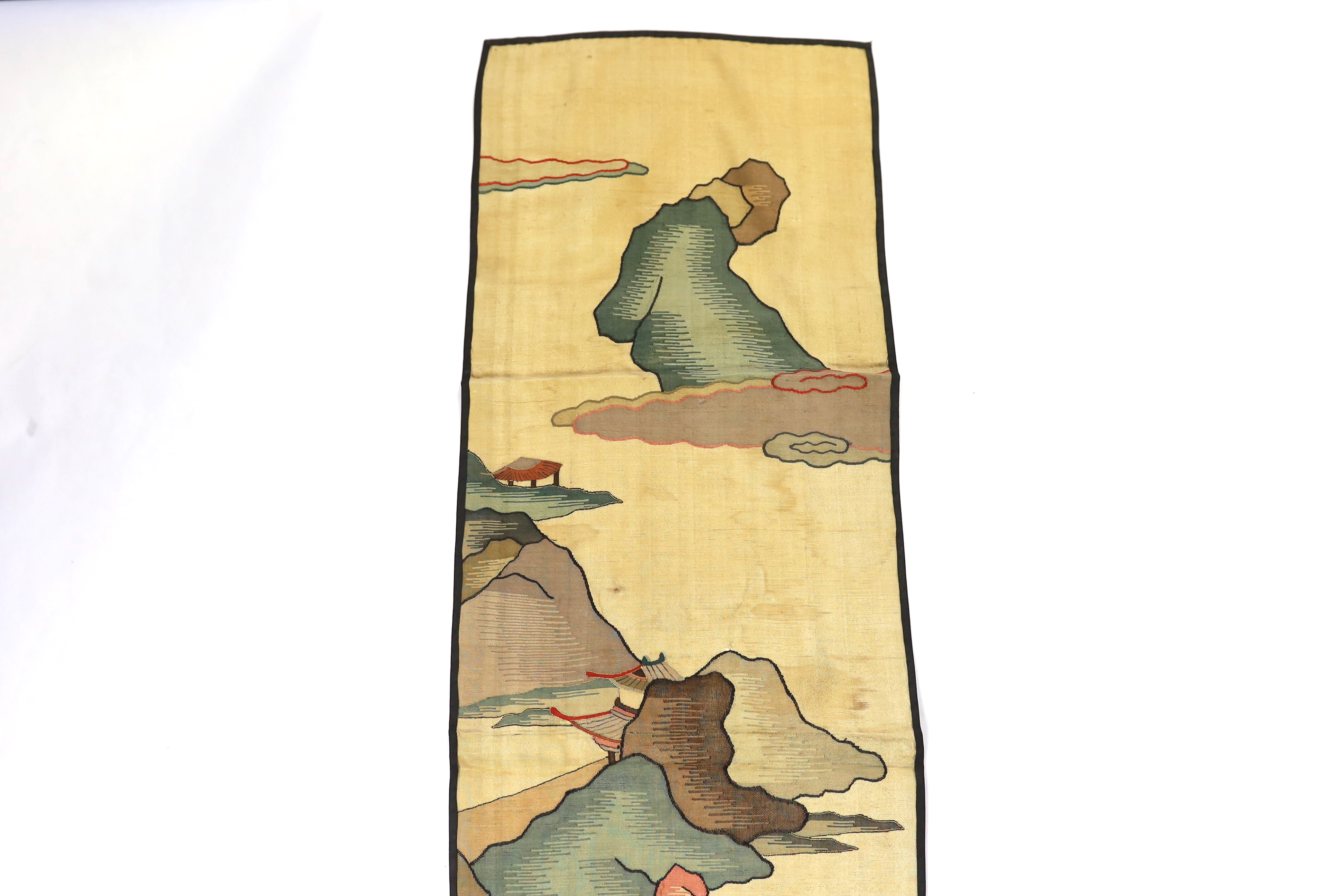A Chinese late Qing dynasty Kesi polychrome silk hanging, depicting a figure on horseback and another walking within a mountainous landscape, together with a smaller later metallic Kesi panel of stylistic 'lishui waves',